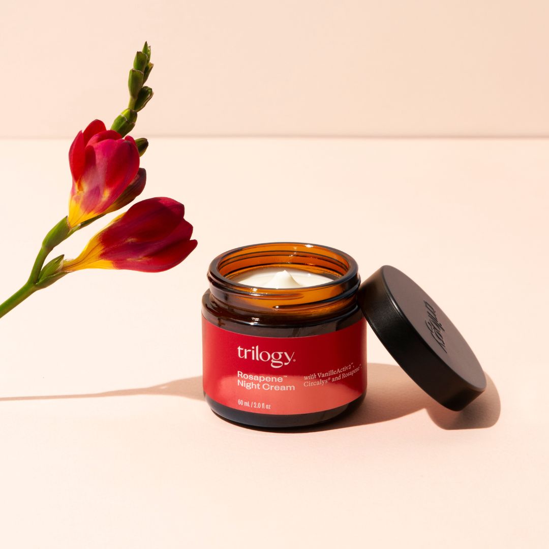 Rosapene™ Night Cream, 60mL open with flower.