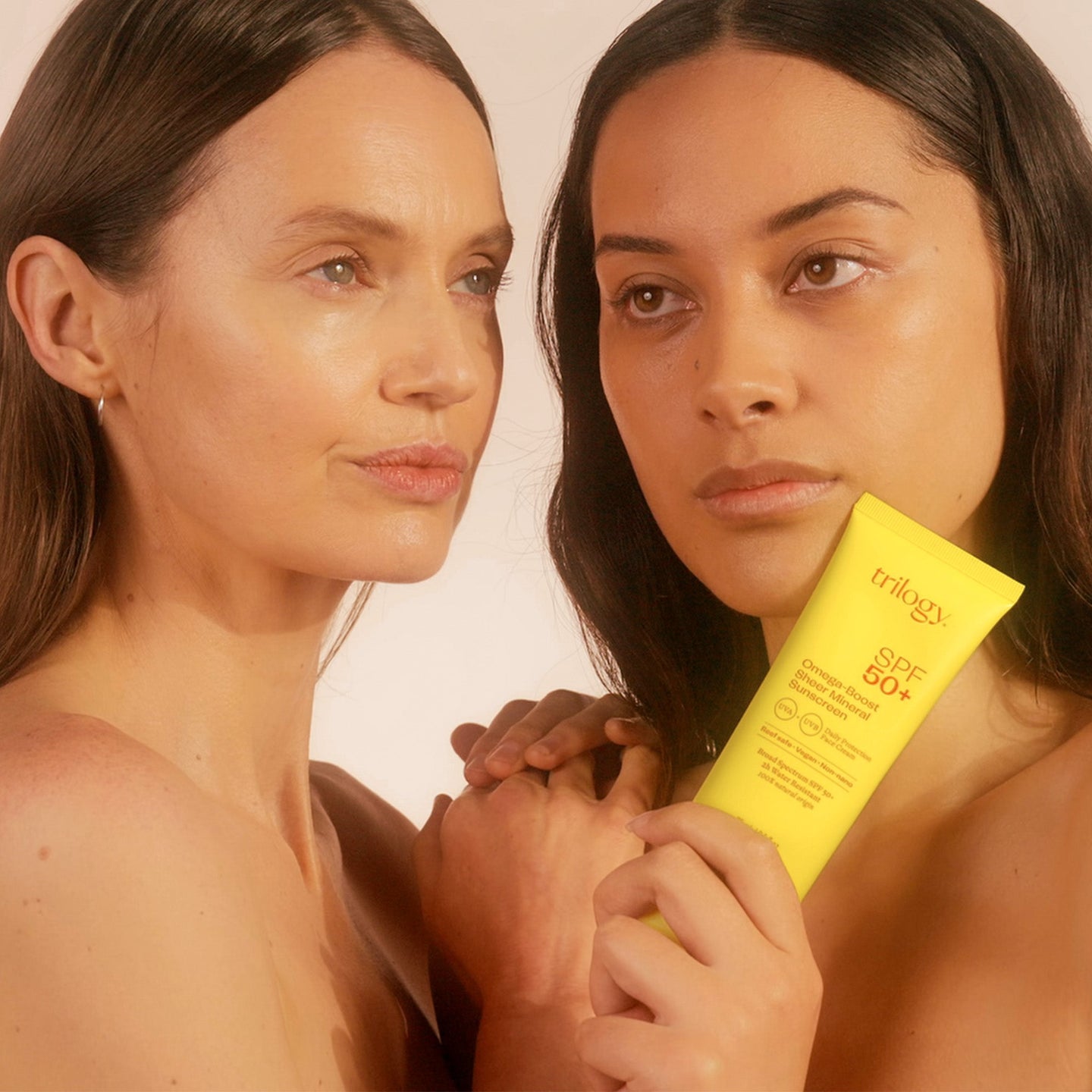 SPF 50+ Omega-Boost Sheer Mineral Sunscreen with two models.