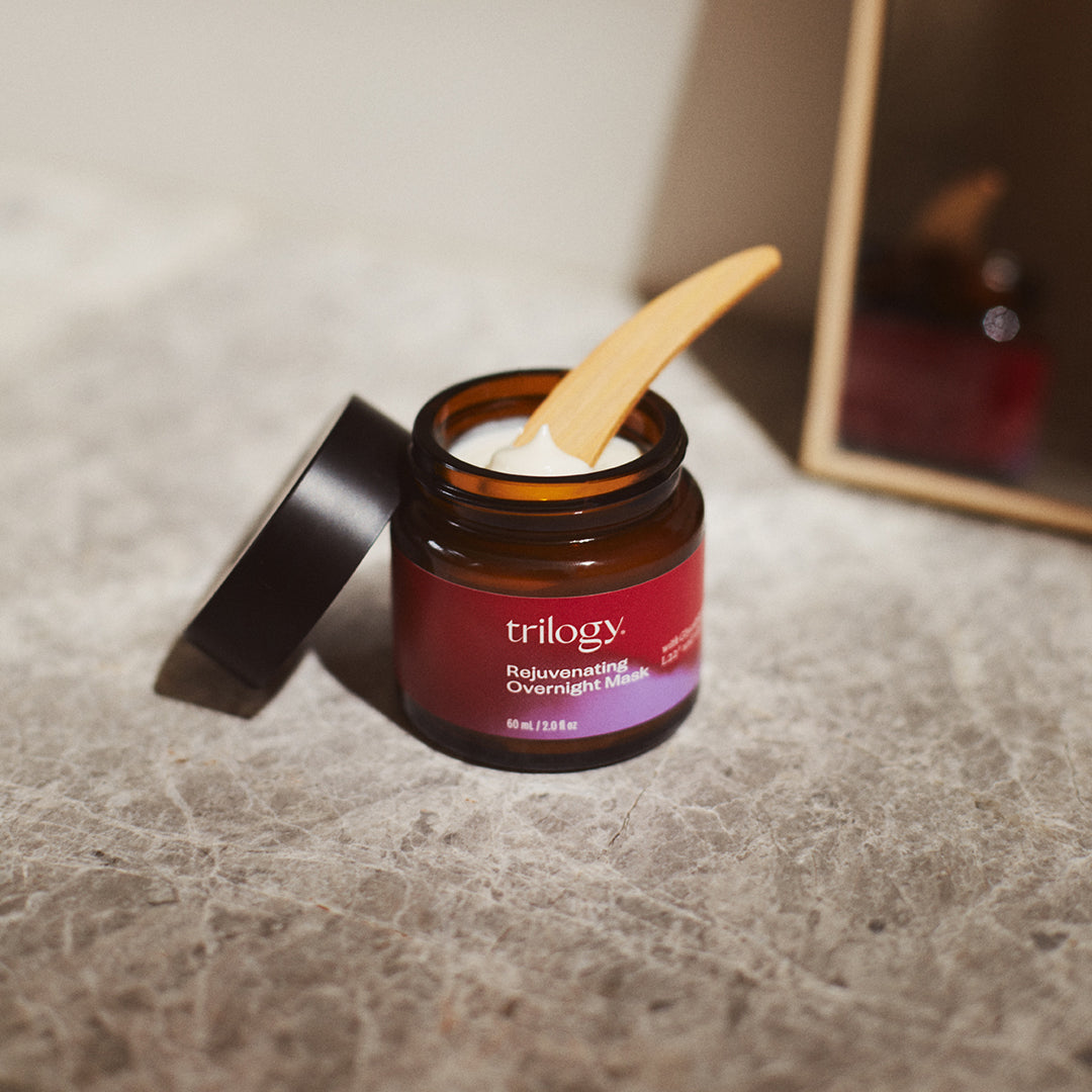 Rejuvenating Overnight Mask in bathroom with lid off to show texture.
