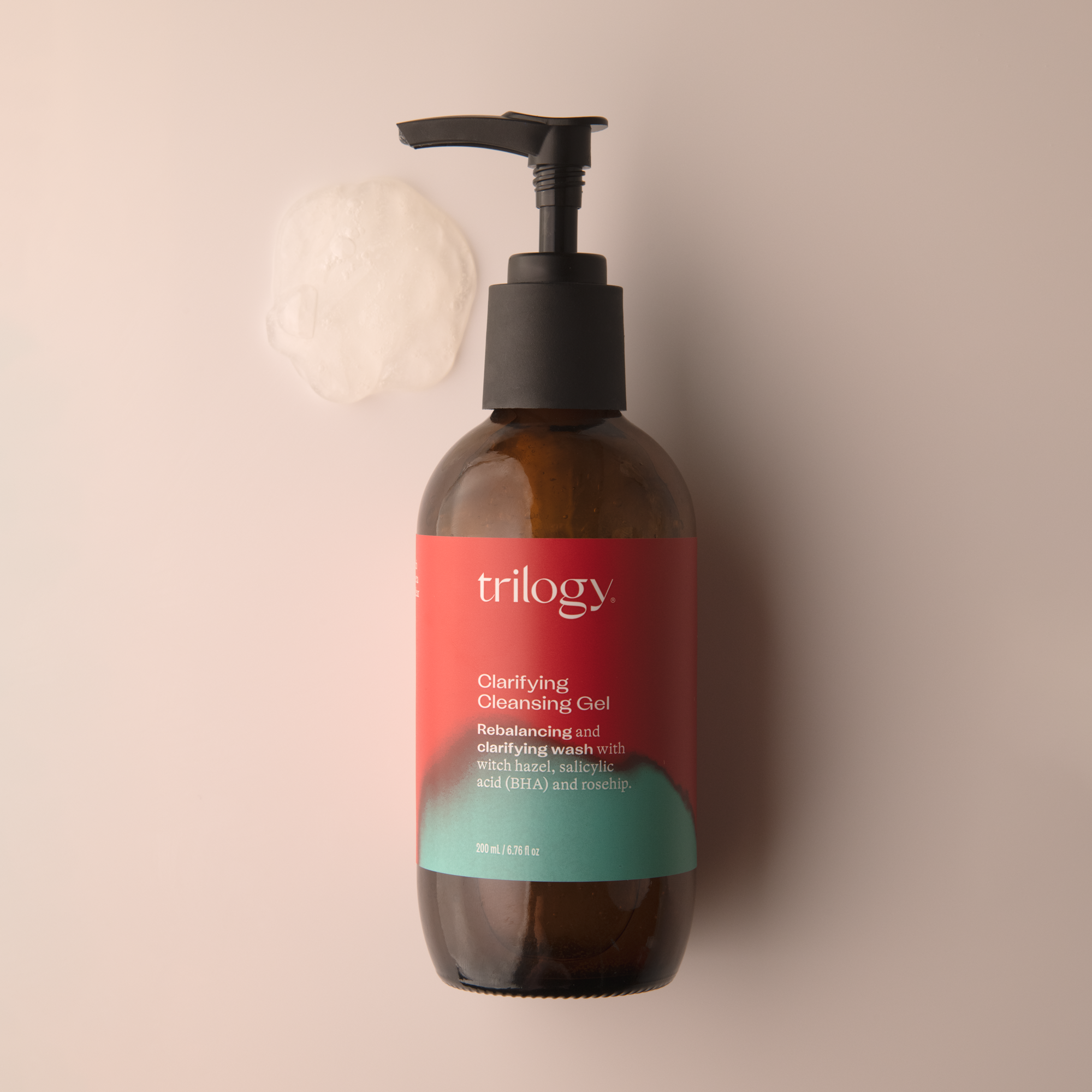 Trilogy Skincare Clarifying Cleansing Gel and gel based facial cleanser with swatch on a beige background.