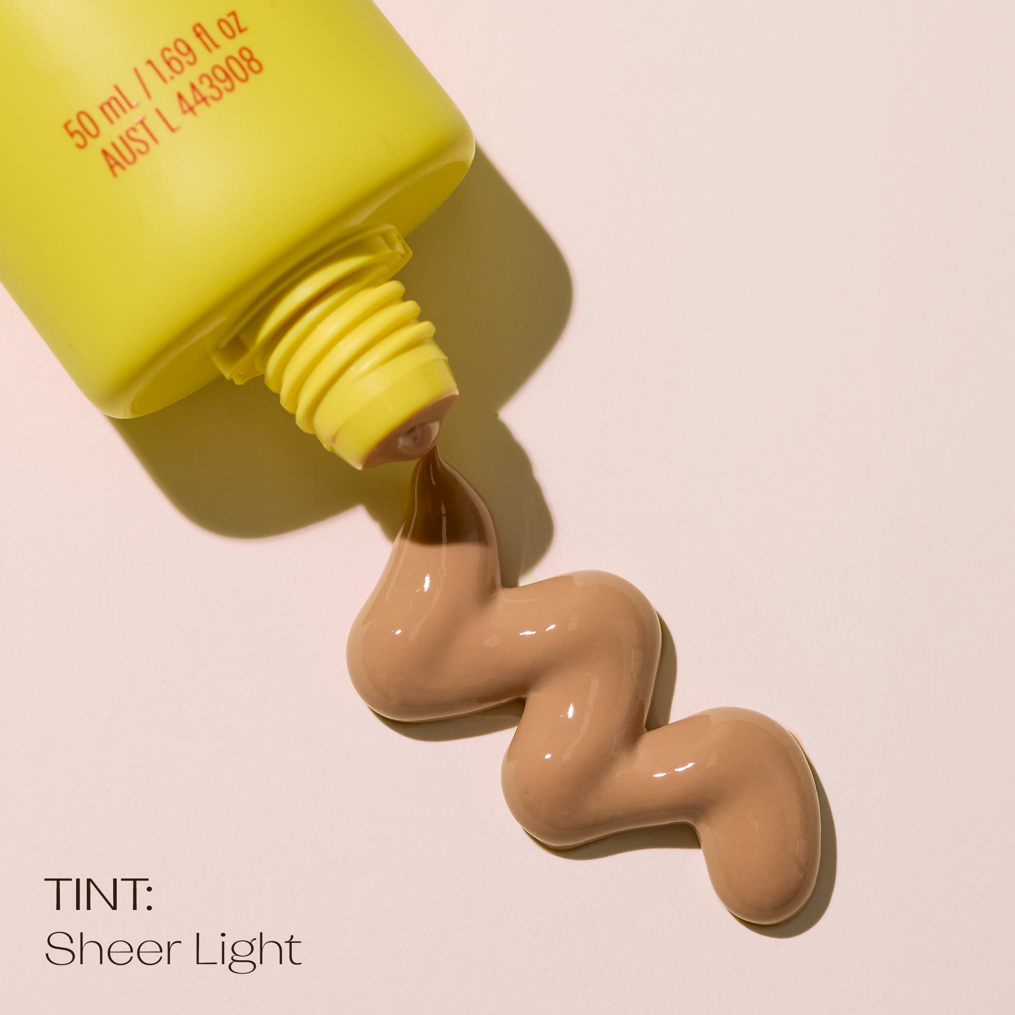 SPF 50+ Sheer Tinted Moisturising Sunscreen light with product showing color and texture.