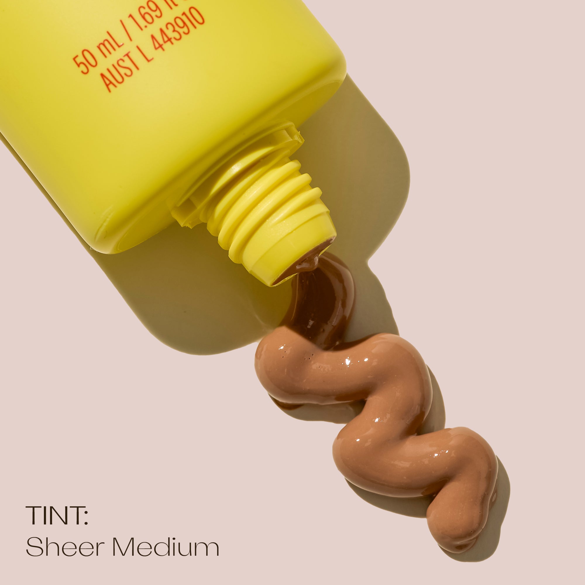 SPF 50+ Sheer Tinted Moisturising Sunscreen medium with product showing texture.