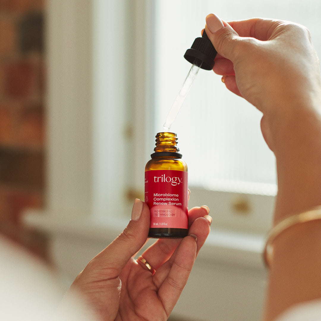 Microbiome Complexion Renew Serum in hand.