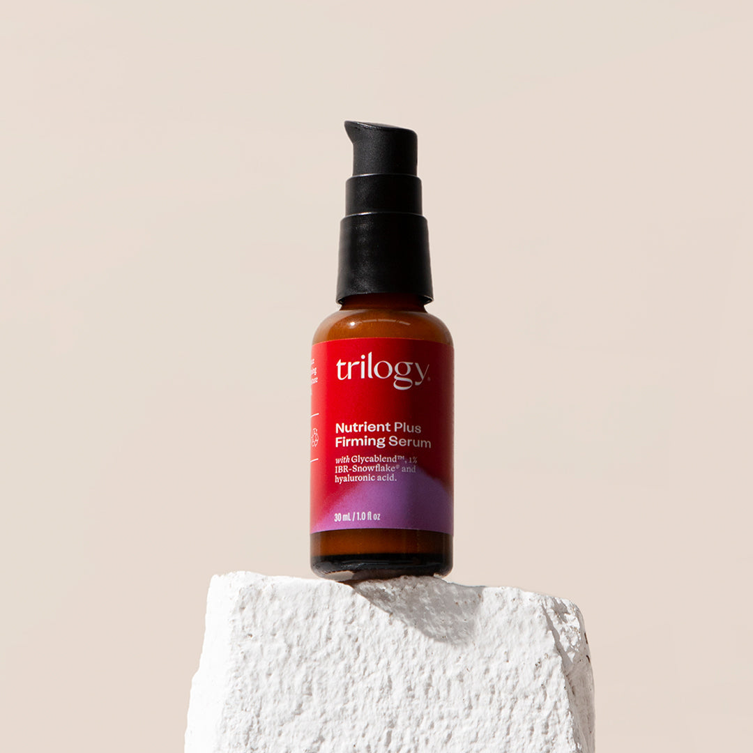 Nutrient Plus Firming Serum on a rock. 