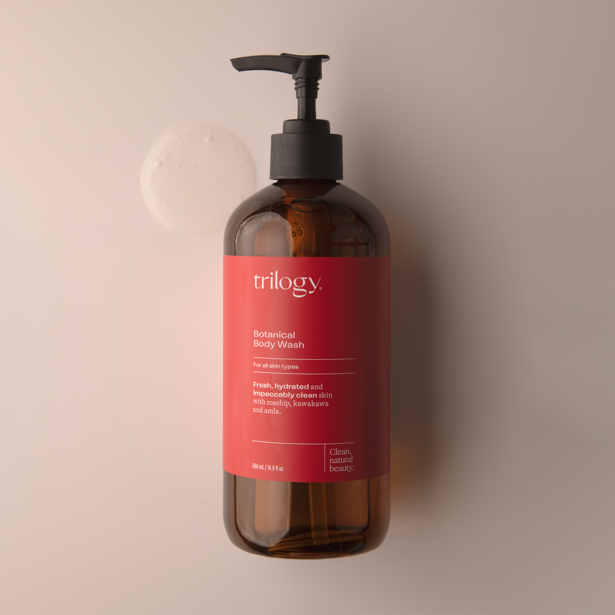 Trilogy Skincare Botanical Body Wash with swatch on beige background. 